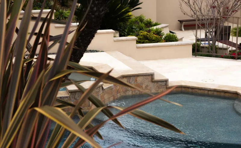 Travertine pool deck with jacuzzi