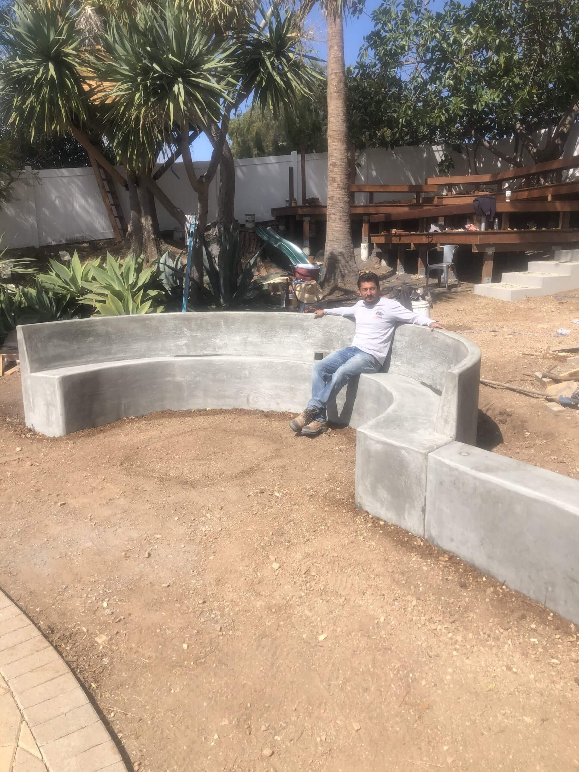 Roy's crew forming a curved concrete bench on a residential job